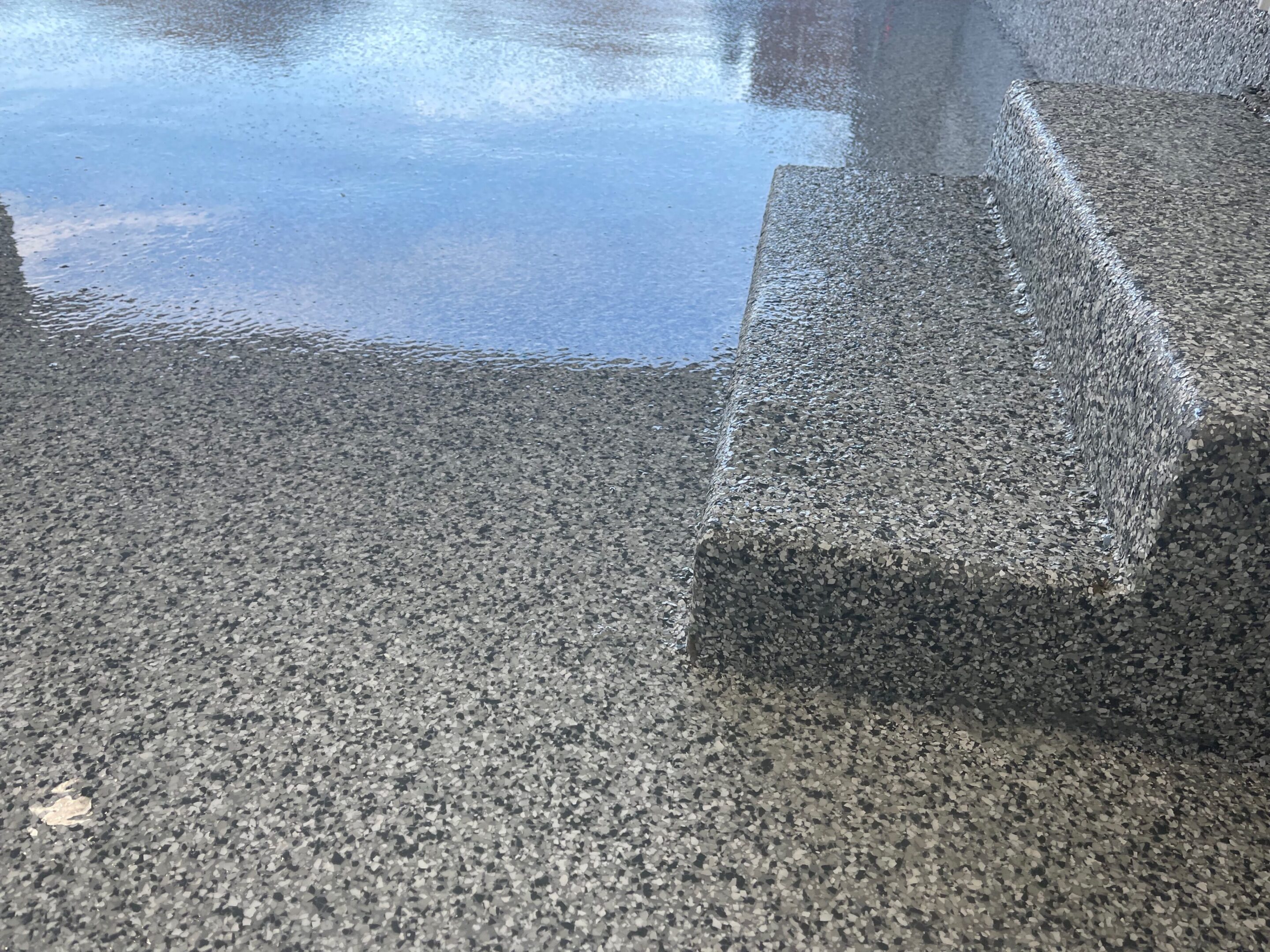 A concrete slab with water on it