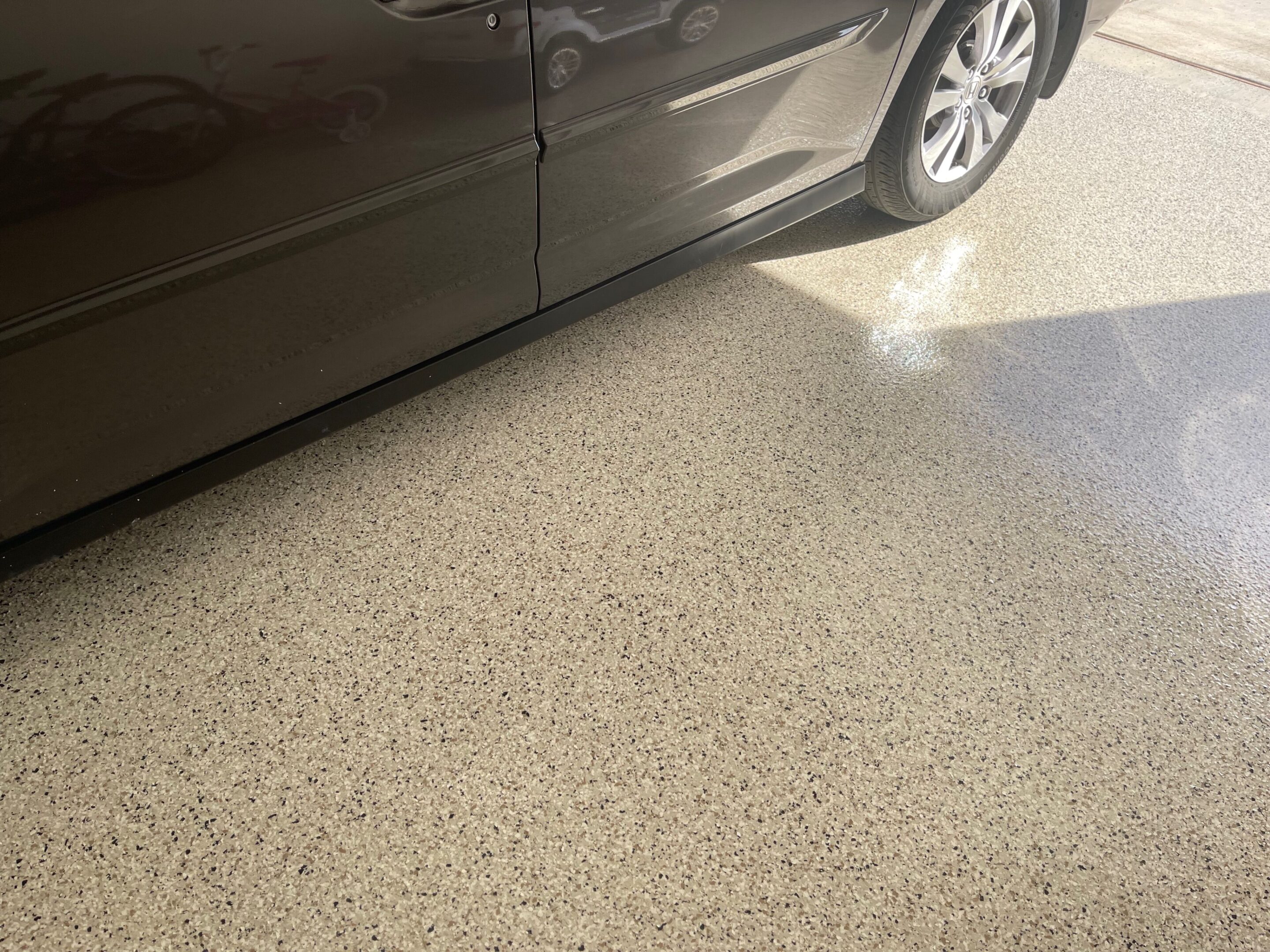 A car parked in the middle of a garage.