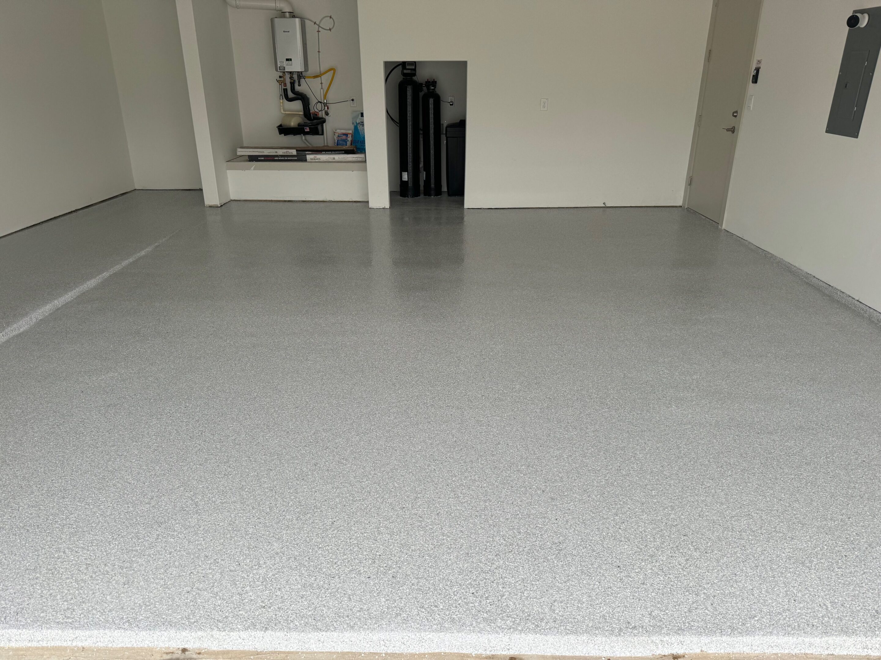 A room with a white floor and grey walls.