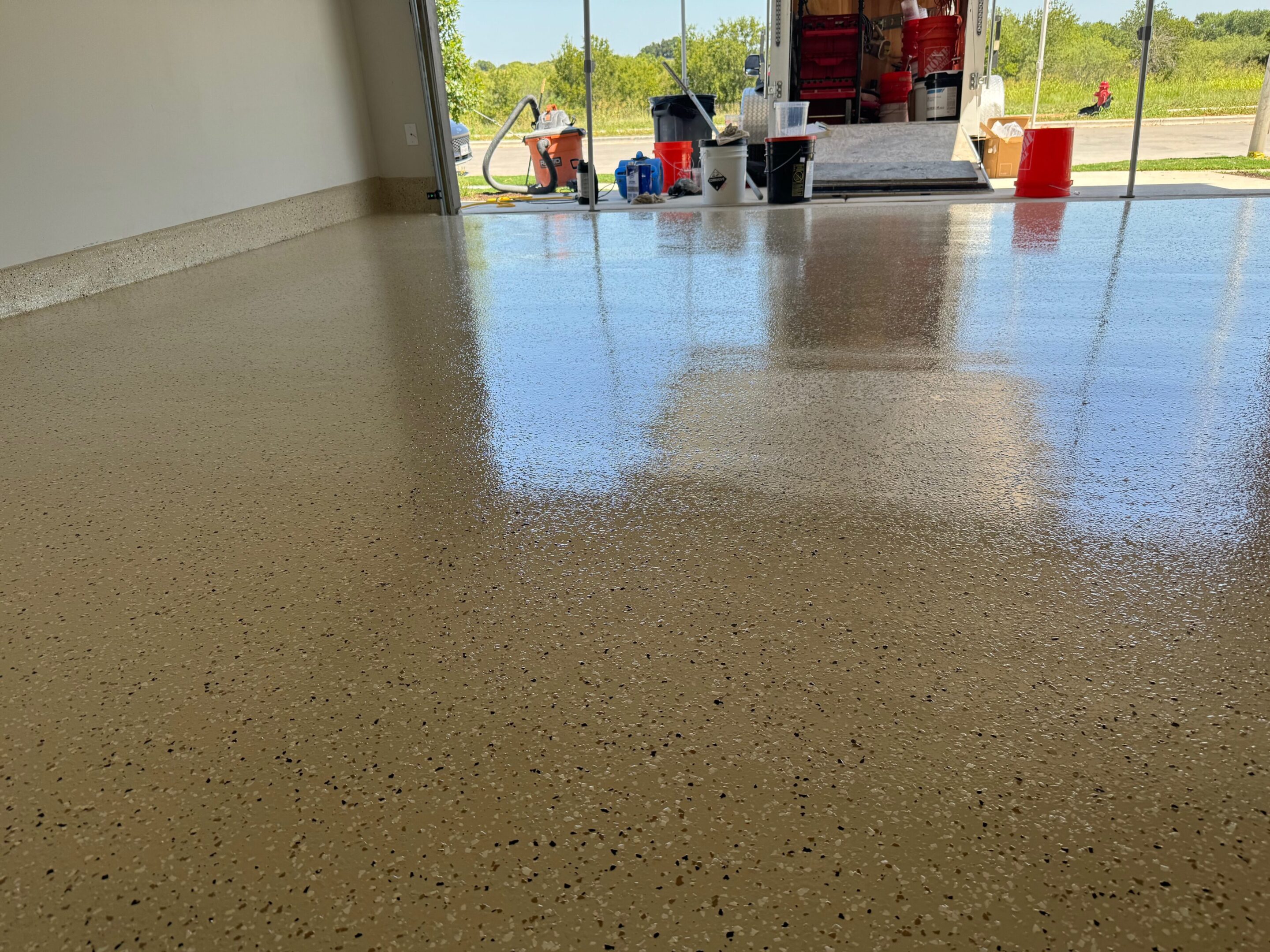A garage floor with many items on it
